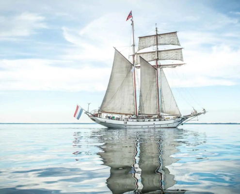 J.R. Tolkien tallship anchored in calm bay – certified for coastal cruising