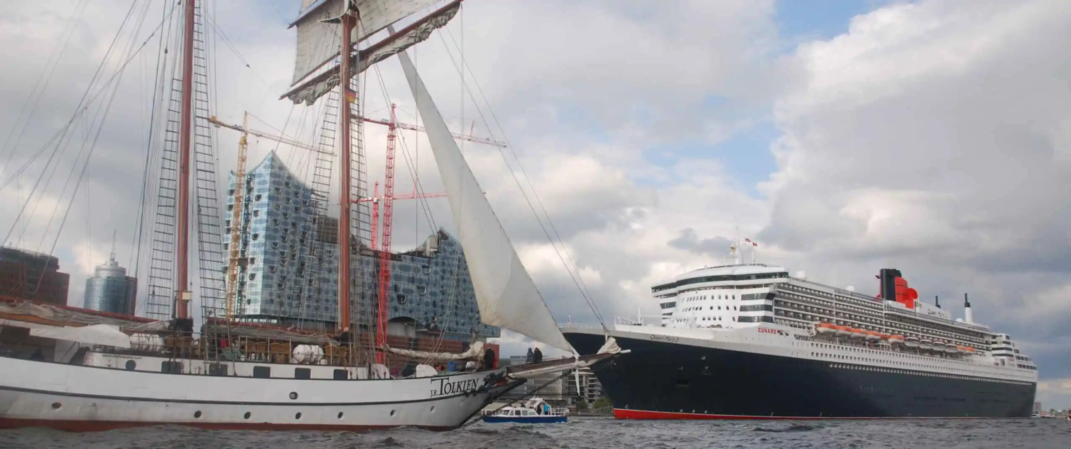 Tallship J.R. Tolkien moored in Hamburg beside Queen Mary – maritime heritage meets modern cruising