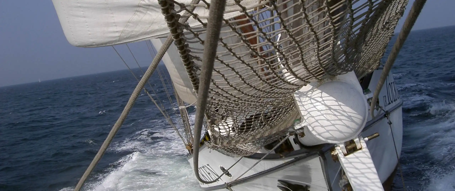 Tallship J.R. Tolkien under full sail on open sea – available for charter
