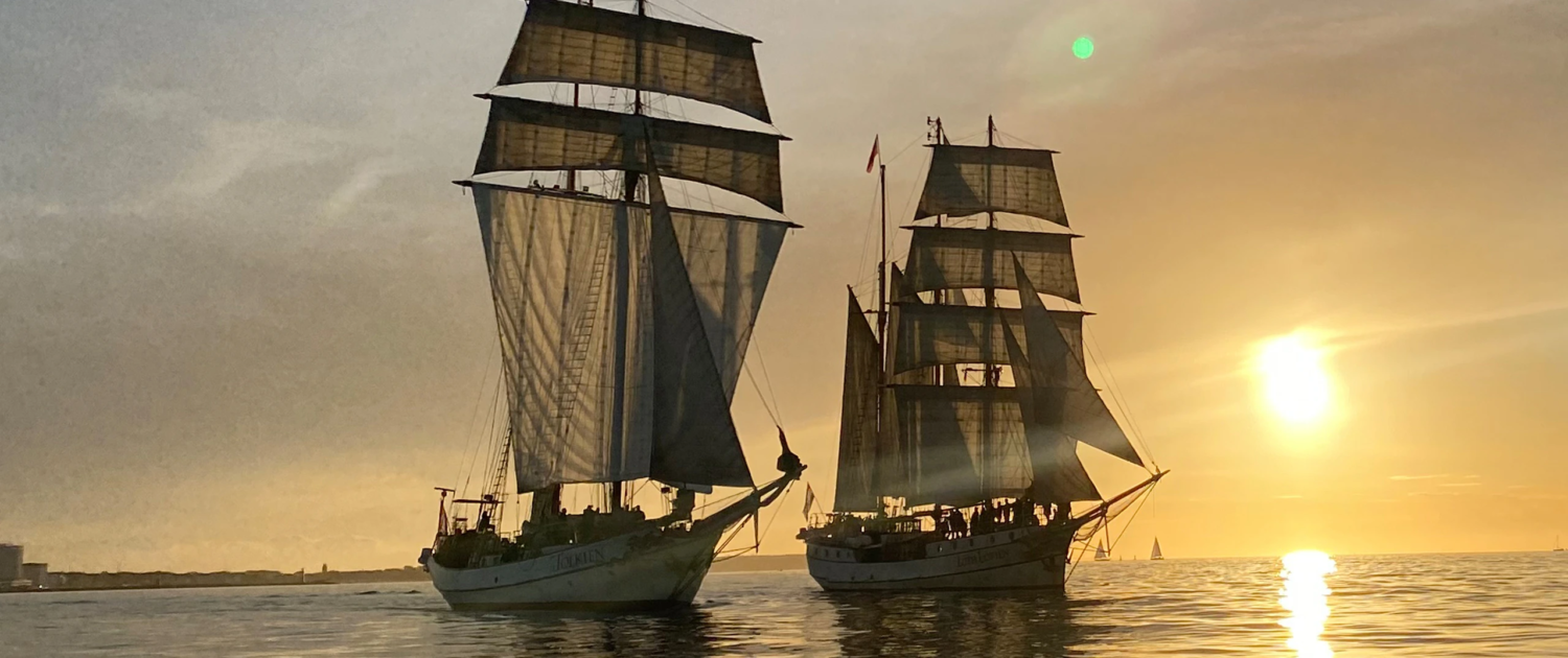 Certified tallships Loth Loriën and J.R. Tolkien at sunset – luxury sailing vessels for sale