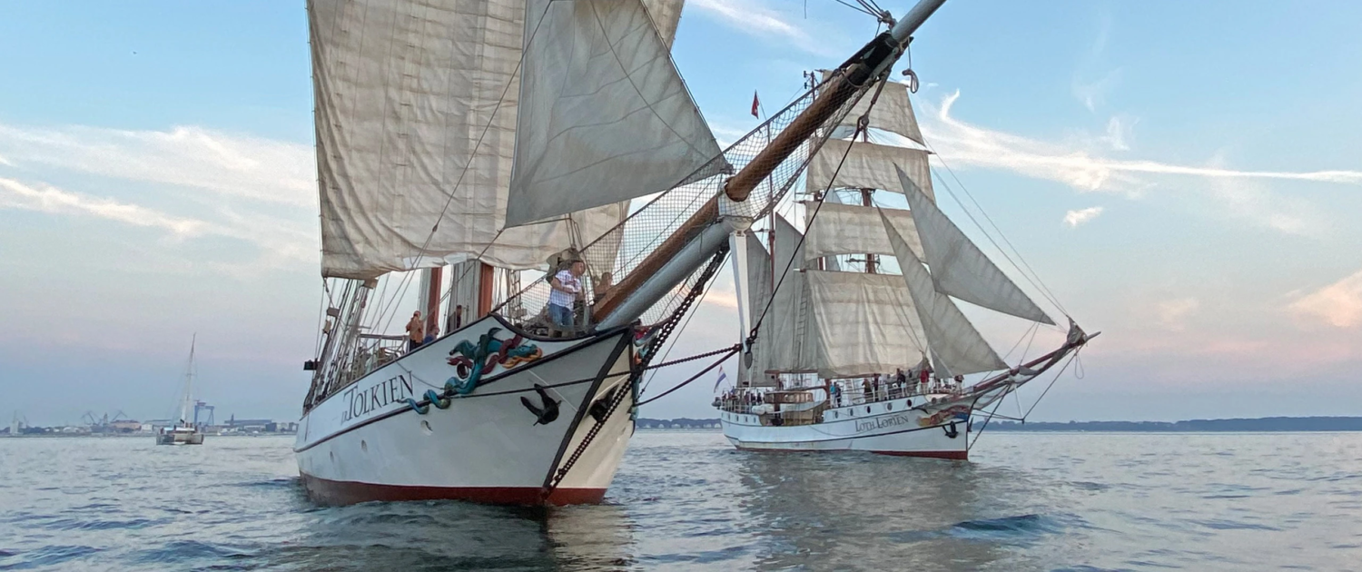 Classic sailing ships Loth Loriën and J.R. Tolkien sailing in formation – charter-ready tallships